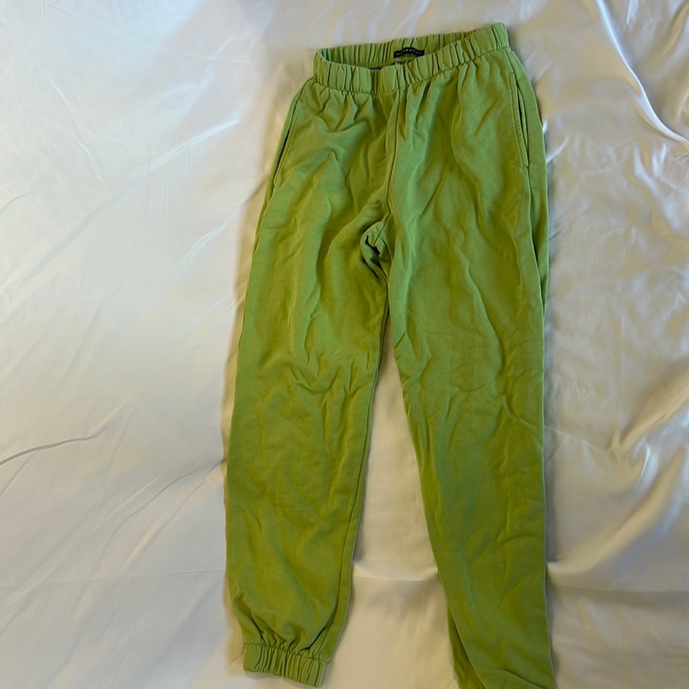 green bendy sweatpants